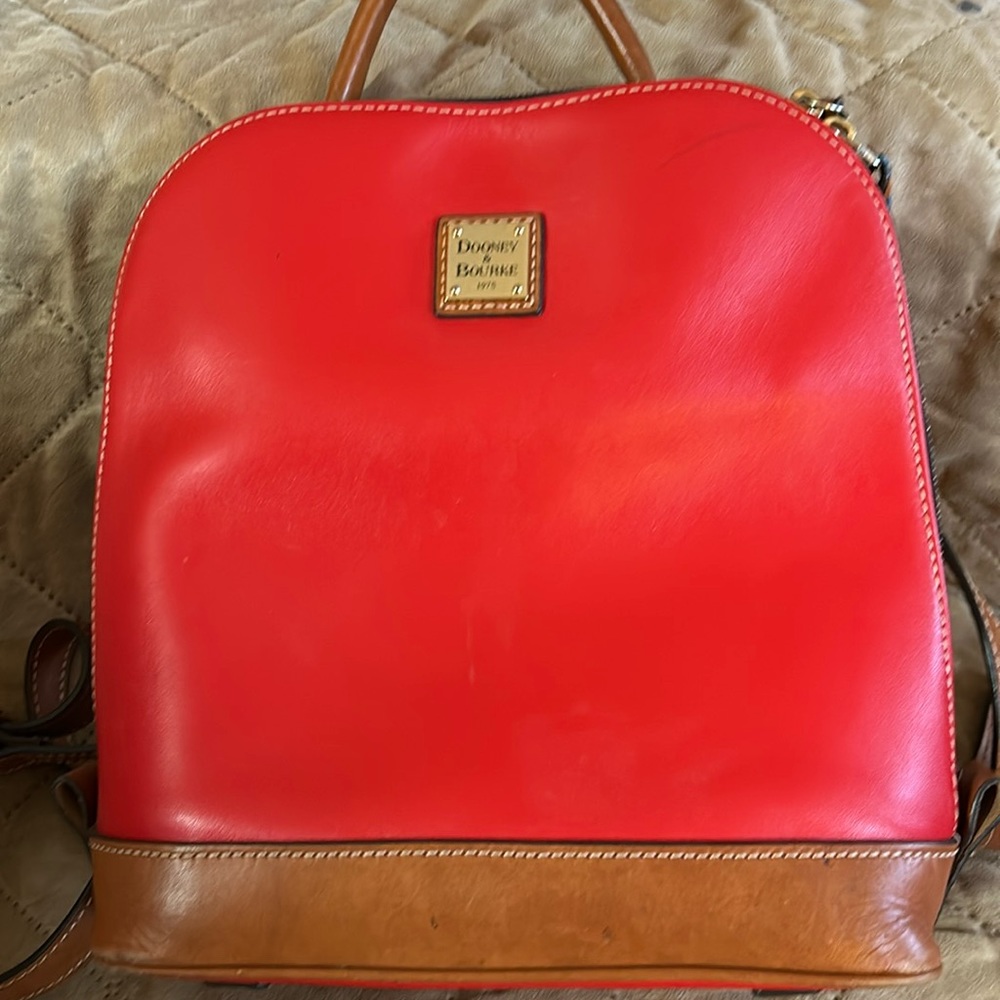 Dooney & Bourke smooth leather pod backpack in coral